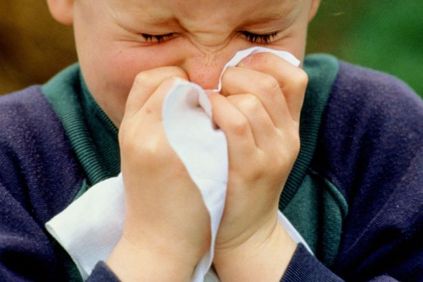 A-young-boy-sneezing