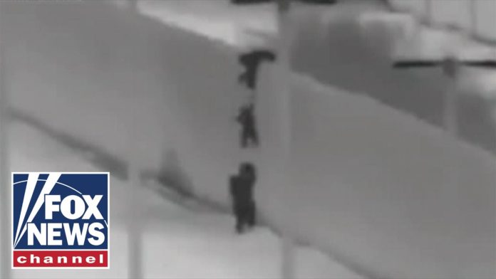 WATCH: Migrants Drop Children Over U.S. Border Wall In Arizona