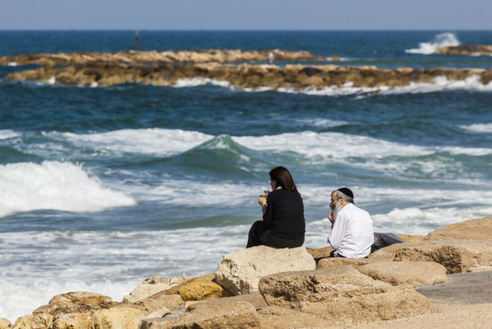 Frum-Couple-on-beach-rocks-SMALL