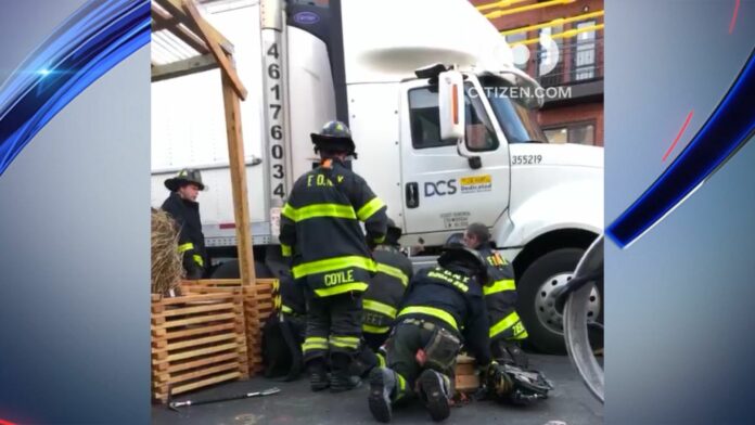 nyc-traffic-cop-rescued-after-being-pinned-under-18-wheeler-in-astoria