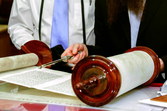 51767660 - jewish man dressed in ritual clothing family man mitzvah jerusalem