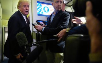 President Donald Trump speaks to reporters aboard Air Force One, Sunday, March 15, 2026, en route from West Palm Beach, Fla. to Joint Base Andrews, Md. (AP Photo/Mark Schiefelbein)