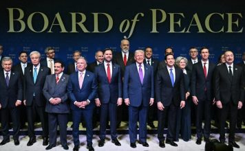 US President Donald Trump (C), flanked by US Vice President JD Vance (L) and US Secretary of State Marco Rubio (R), joins leaders for a group photo during the inaugural meeting of the Board of Peace at the US Institute of Peace in Washington, DC, on February 19, 2026. (SAUL LOEB / AFP)