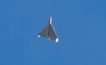 An Iranian Shahed exploding drone launched by Russia flies through the sky seconds before it struck buildings in Kyiv, Ukraine, on Oct. 17, 2022. (AP Photo/Efrem Lukatsky, File)